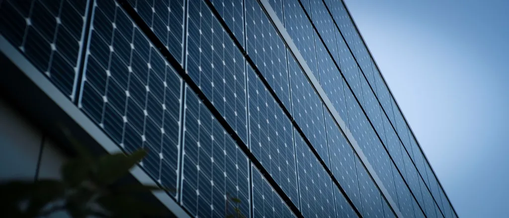 Close view of photovoltaic cells across a solar panel.